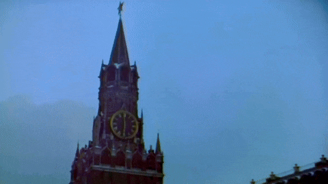 a clock on a building with roman numerals shows a time of 1:50