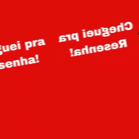 a man and a woman are standing next to each other on a red background holding handbags .