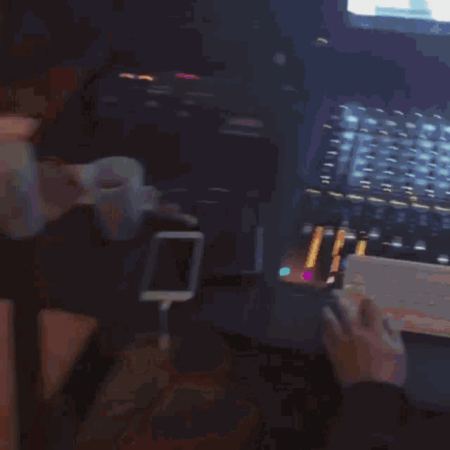 a blurred image of a roller coaster ride with a few people riding it