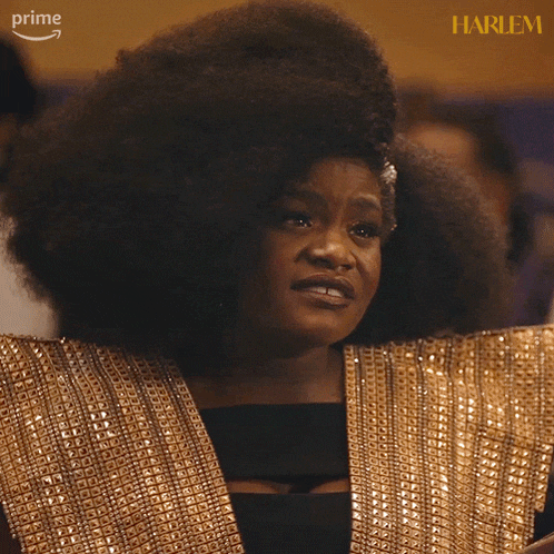 a woman says i 'm a grown woman while wearing a gold dress