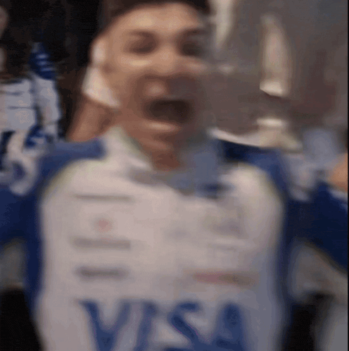 a blurry photo of a person wearing a visa shirt