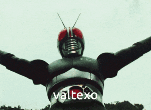a man in a masked superhero costume is standing in the dirt with the word valtexo written on the bottom