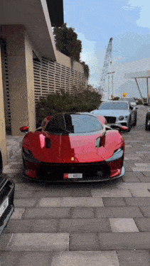 a red sports car with a license plate that says ' sd ' on it