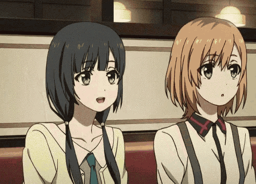 two anime girls are sitting next to each other on a bench