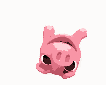 a pink pig with big eyes is laying on its back on a white surface .