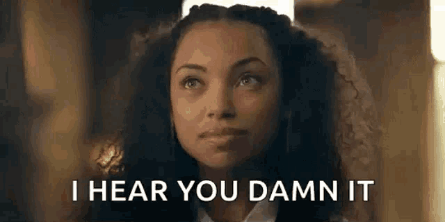 a woman is saying `` i hear you damn it '' while looking up at the sky .