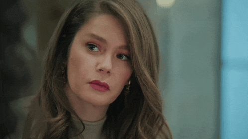 a close up of a woman 's face with red lipstick