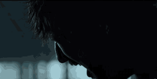 a close up of a man 's face with water coming out of his nose