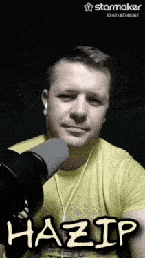 a man wearing headphones and a yellow shirt with the name hazip written on it