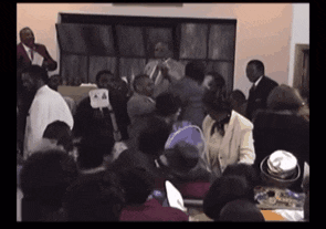 a group of people are gathered in a room with a sign that says a4 on it
