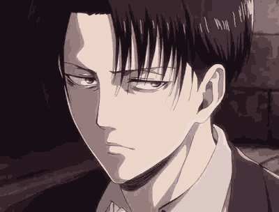 a close up of a person 's face with a serious look on their face .