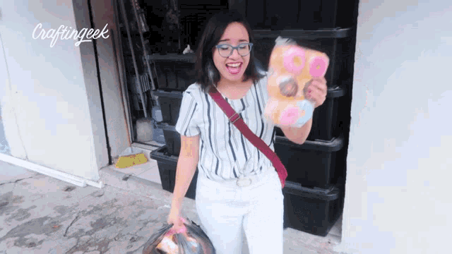 a woman is holding a bag of donuts in front of a craftinggeek logo
