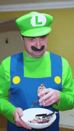 a man in a luigi costume is eating cereal with a fork