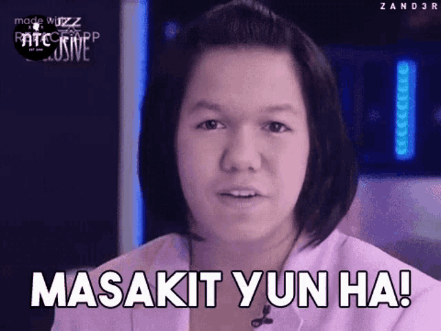 a young girl with short hair is making a funny face and says masakit yun ha !
