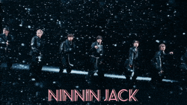 a man is behind a beam of light with the name ninnin jack written in pink