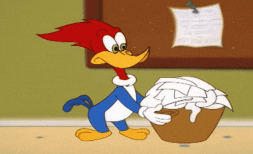 woody woodpecker holding a basket of papers in front of a bulletin board