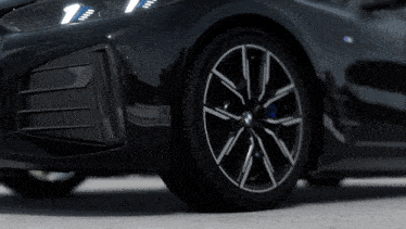 a close up of a bmw wheel with a black tire
