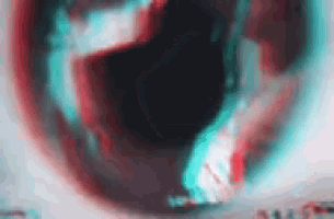 a close up of a person 's eye with a red , blue , and green glow .