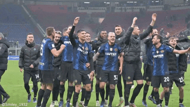 a group of soccer players wearing inter jerseys