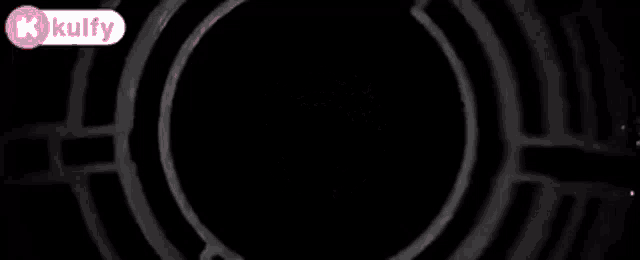 a black background with a circle in the middle and the word kulfy in the corner