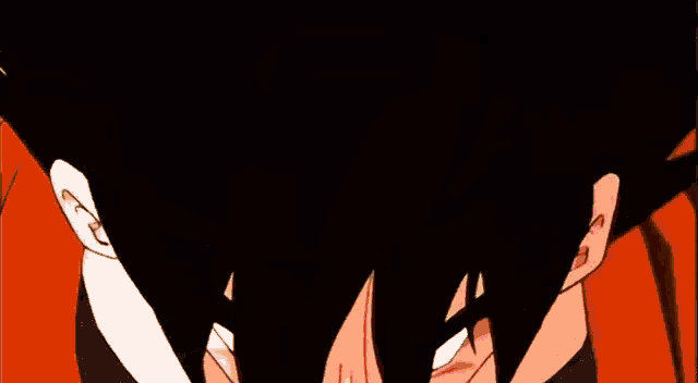 a close up of a cartoon character 's face with an orange shirt