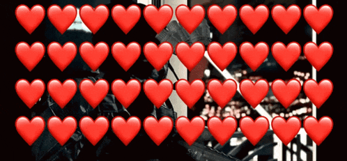 a row of red hearts with a black background