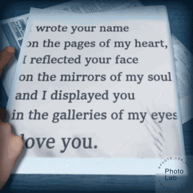 a person is holding a piece of paper that says " wrote your name on the pages of my heart "
