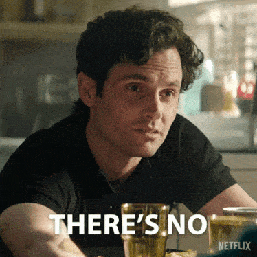 a man sitting at a table with a netflix logo on the bottom