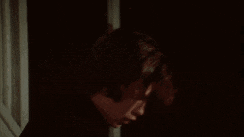 a close up of a person 's hand holding a knife .