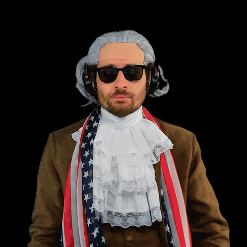 a man wearing a wig and sunglasses is wearing an american flag scarf around his neck