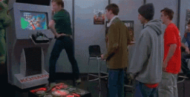 a group of young men are playing a video game called konami