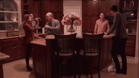 a group of people are gathered in a kitchen with abc written on the bottom of the screen