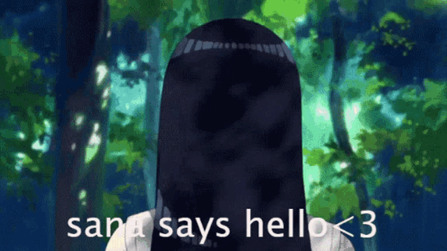 a girl with long black hair says hello < 3 in front of a forest