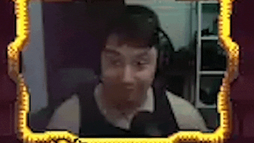 a man wearing headphones looks at the camera in a picture frame