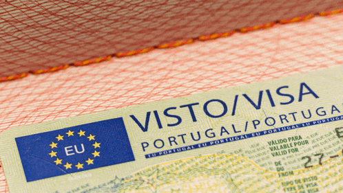 a passport opened to a page that says visto / visa portugal / portugal