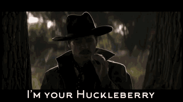 a man in a cowboy hat says i 'm your huckleberry .