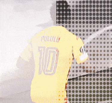 a yellow soccer jersey with the number 10 on the back
