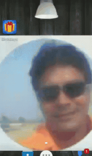 a man wearing sunglasses is on a video call with a birthdays icon