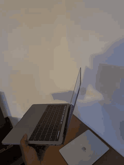 a person is holding a laptop with a keyboard that says ' ctrl ' on it