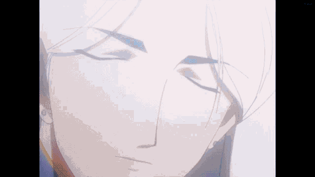 a close up of a man 's face with his eyes closed