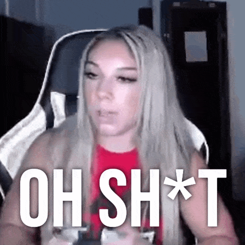 a woman sitting in a chair with the words oh sh * t written on the screen