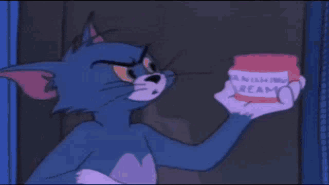 a woman in a blue jersey with the number 69 on it is screaming .