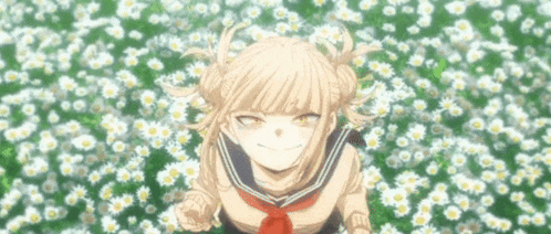 a girl in a sailor uniform is standing in a field of daisies .