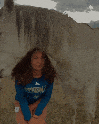 a girl in a blue shirt that says freedom