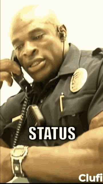 a police officer is talking on a phone with the word status written on the bottom .