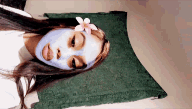 a woman with a blue mask on her face