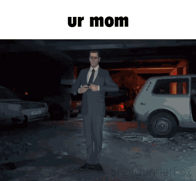 a man in a suit and tie is standing in front of a car with the words ur mom written above him