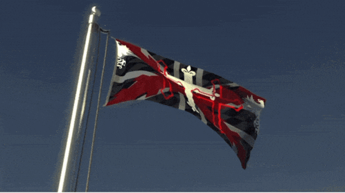 a flag that has a cross on it is flying in the wind
