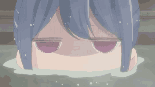 a girl is taking a bath in a hot tub with her eyes closed and her head sticking out of the water .