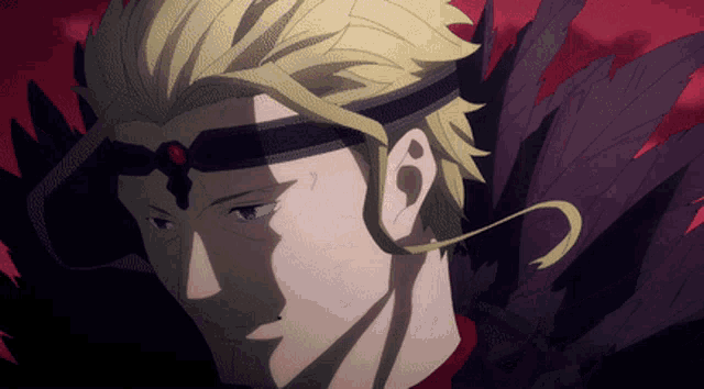 a close up of a man 's face with a headband on his head
